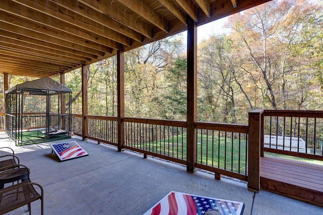 wooden terrace featuring a gazebo