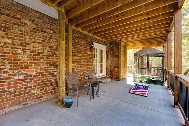 view of patio with a gazebo and french doors