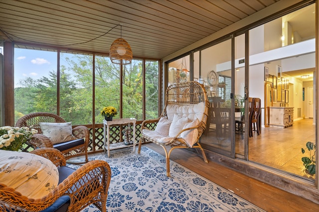 sunroom / solarium featuring wooden ceiling