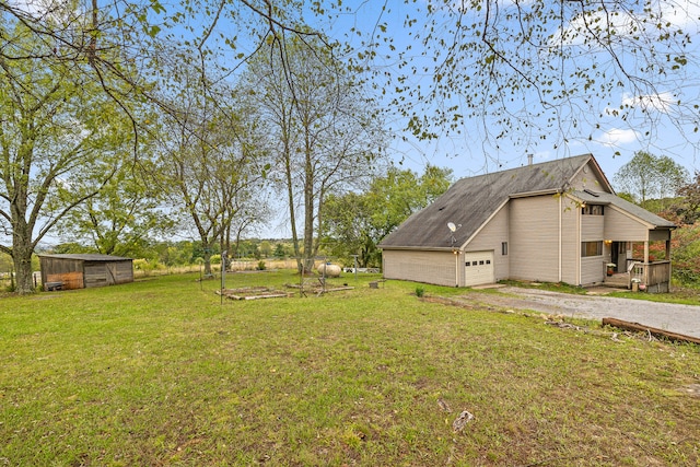 view of yard with a garage