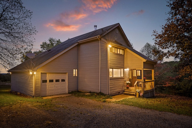 property exterior at dusk with a garage