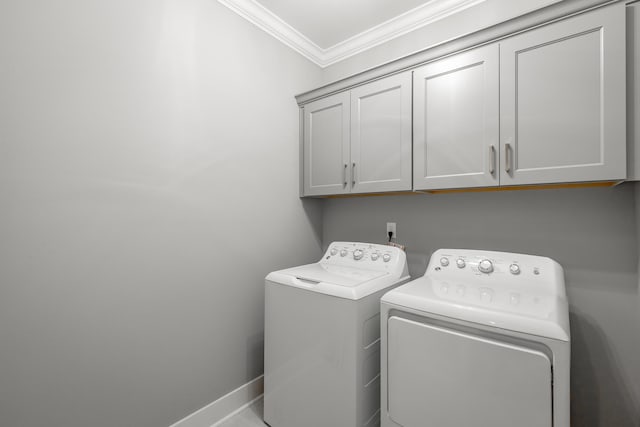 washroom with cabinets, independent washer and dryer, and crown molding