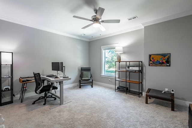 office space featuring crown molding, light colored carpet, and ceiling fan