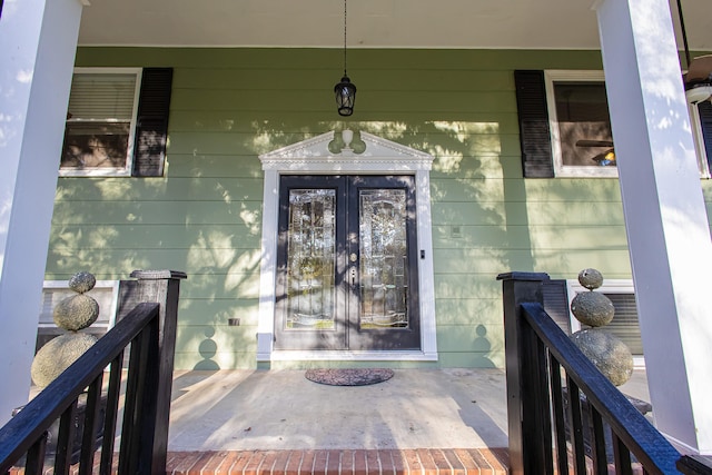 property entrance with covered porch