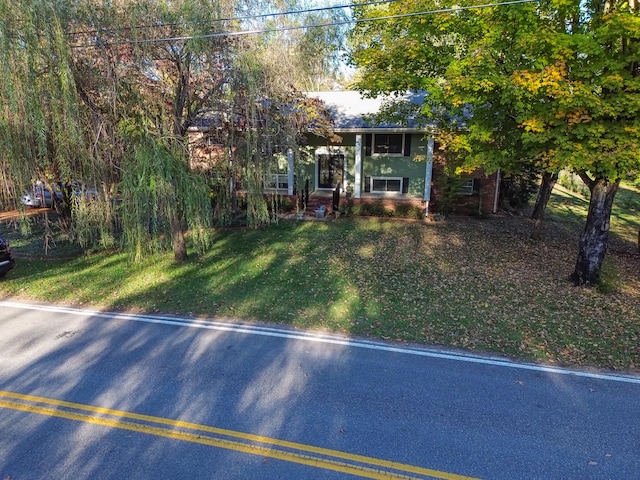 view of front of home with a front yard