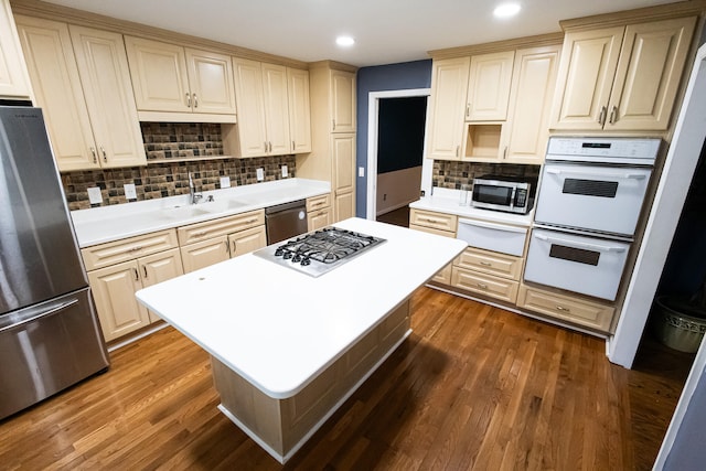 kitchen featuring tasteful backsplash, stainless steel appliances, and dark wood-type flooring