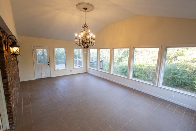 unfurnished sunroom featuring a wealth of natural light, a chandelier, and vaulted ceiling