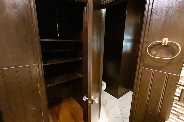 interior space featuring hardwood / wood-style flooring and toilet