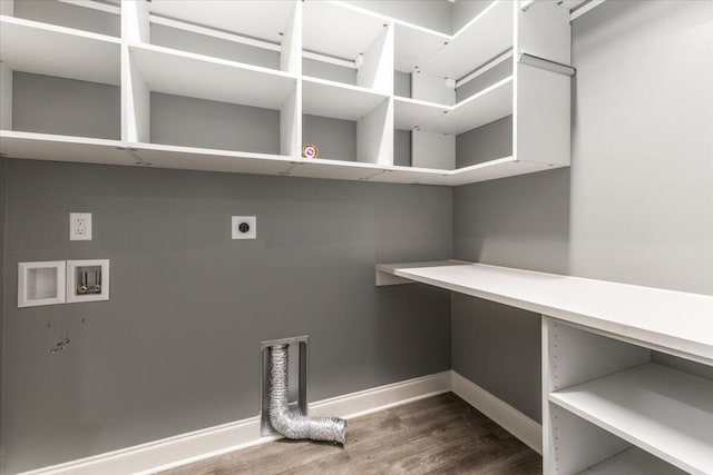 washroom with hookup for an electric dryer, hookup for a washing machine, and wood-type flooring