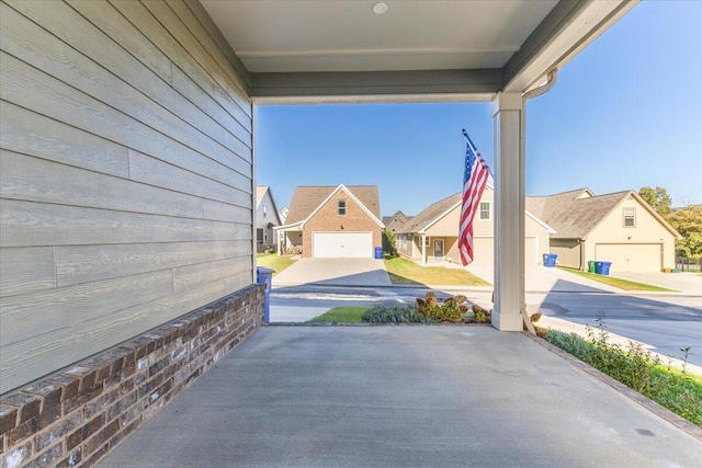 view of patio / terrace featuring a garage