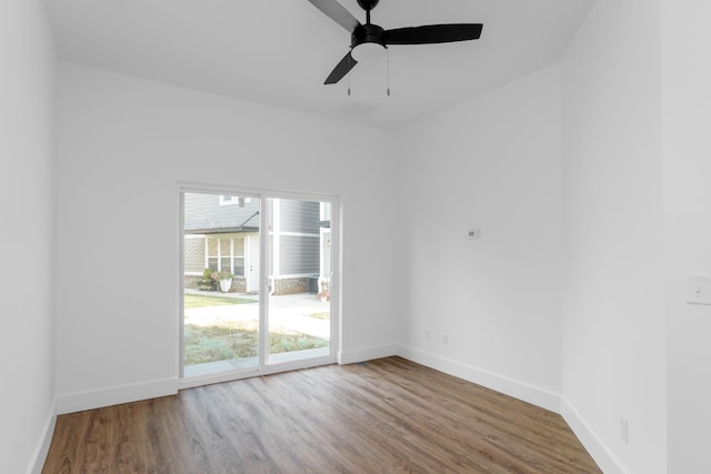 empty room with hardwood / wood-style flooring and ceiling fan