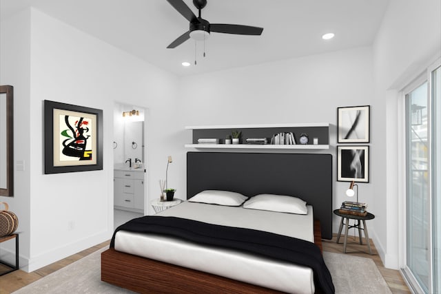 bedroom with hardwood / wood-style floors, connected bathroom, and ceiling fan