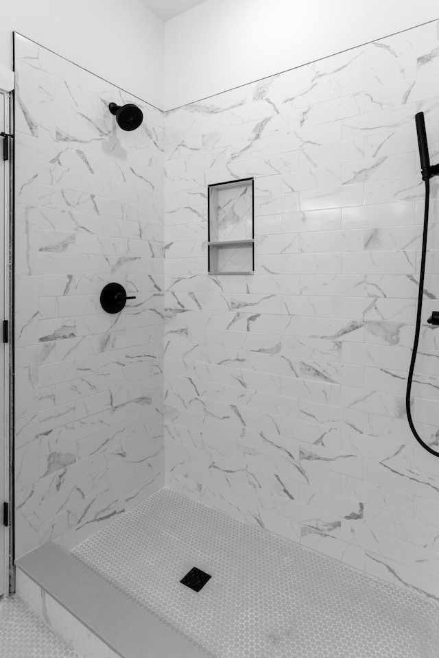 bathroom featuring tiled shower