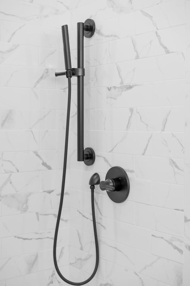 details with a tile shower