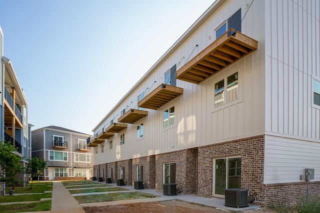 view of building exterior with central AC