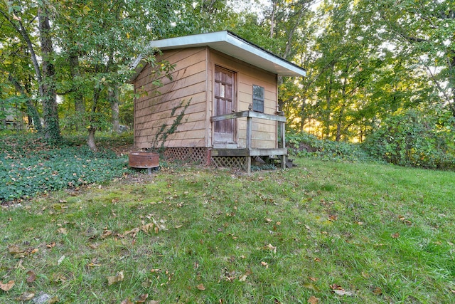 view of outbuilding with a lawn