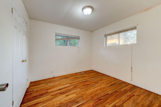 spare room with light wood-type flooring