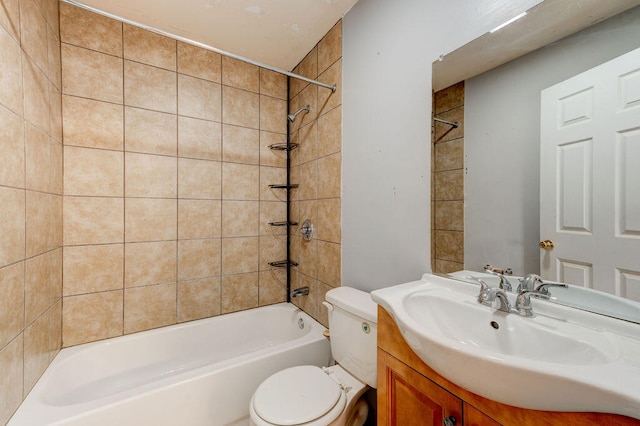 full bathroom featuring vanity, toilet, and tiled shower / bath