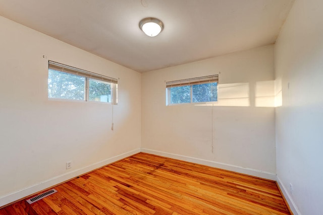 unfurnished room featuring light hardwood / wood-style flooring