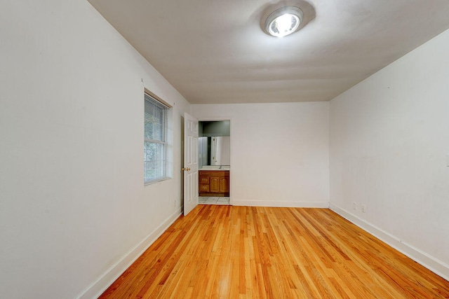 unfurnished room with light hardwood / wood-style floors