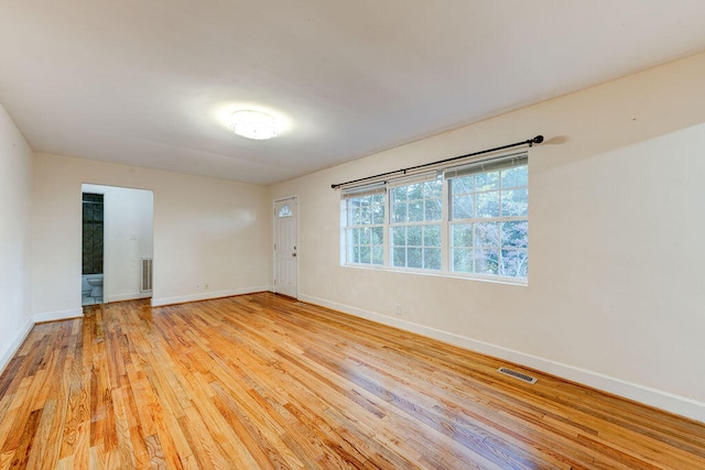 spare room with light wood-type flooring