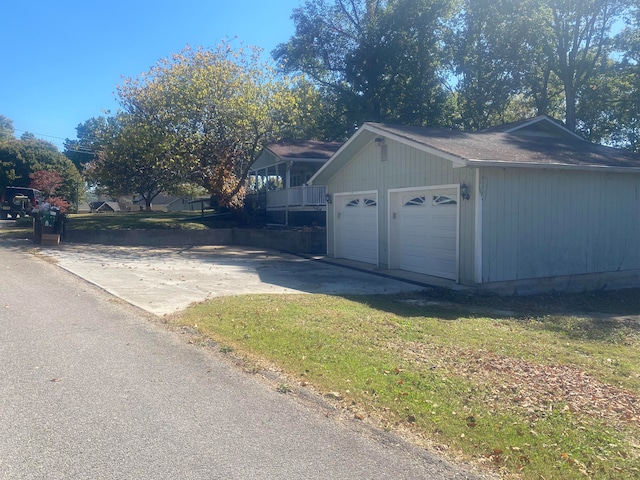 garage featuring a yard