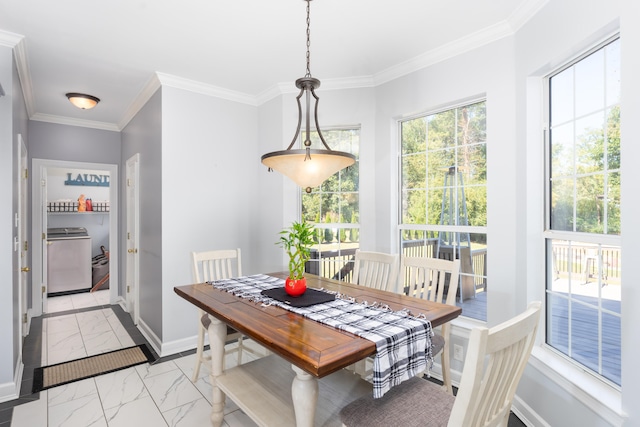 dining room with washer / dryer and ornamental molding