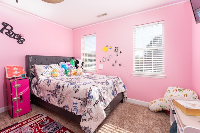 bedroom with carpet flooring and multiple windows