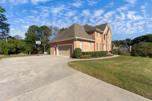 view of home's exterior with a yard and a garage