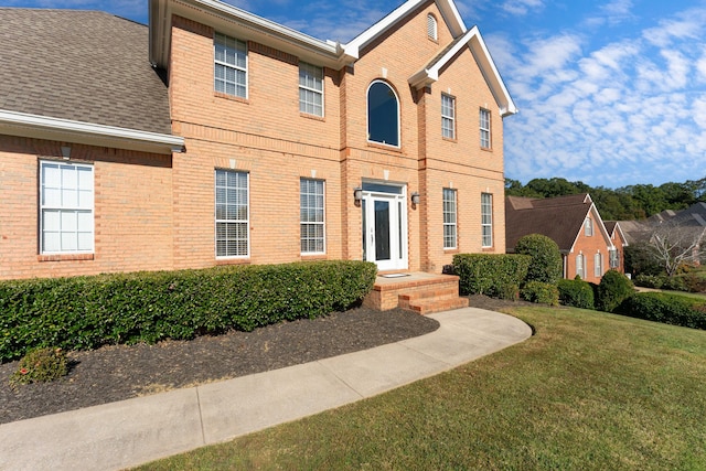 view of front of home with a front lawn