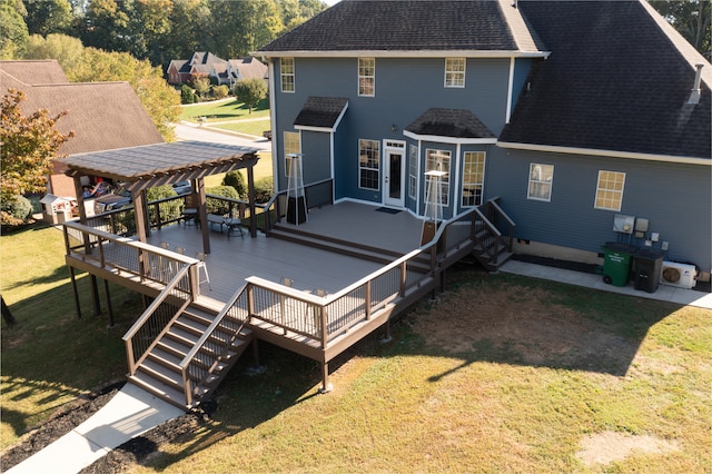 back of house with a yard and a wooden deck