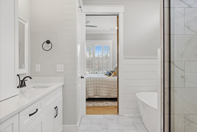 bathroom with vanity and a washtub