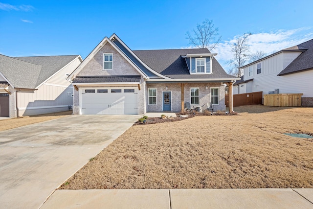 view of front of home featuring a porch and a garage