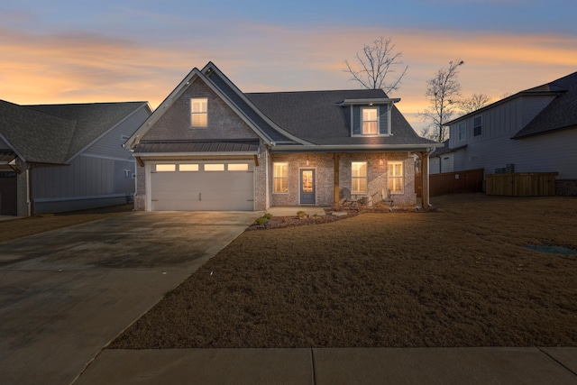 view of front of house featuring a yard and covered porch