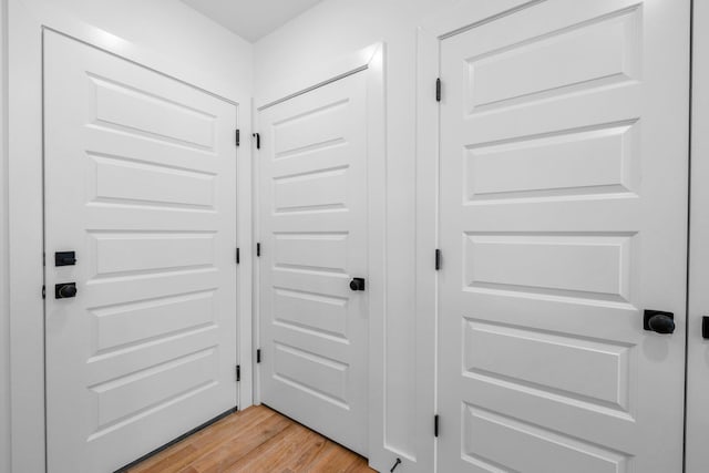 doorway with light hardwood / wood-style flooring