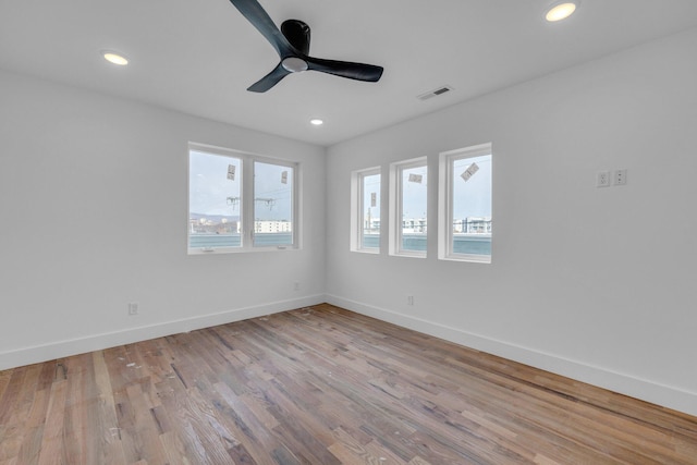 spare room featuring ceiling fan and light wood-type flooring