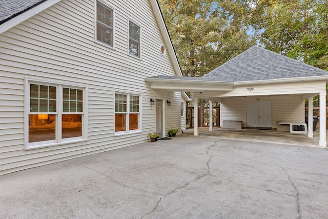 view of property exterior with a carport