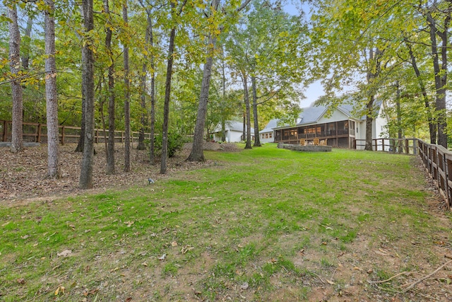 view of yard with a sunroom