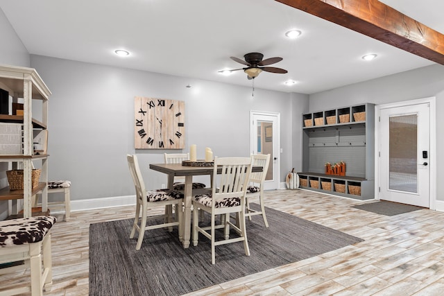 dining area with ceiling fan and light hardwood / wood-style floors