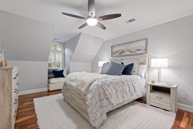 bedroom with dark hardwood / wood-style floors, vaulted ceiling, and ceiling fan