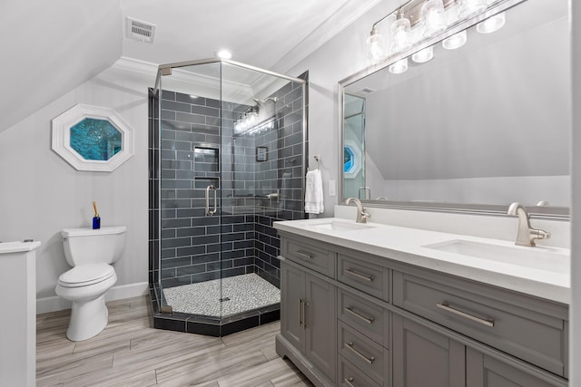 bathroom featuring vanity, toilet, an enclosed shower, and crown molding