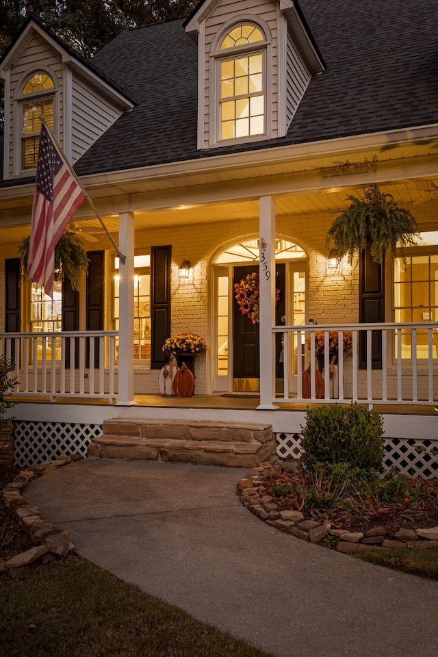 doorway to property featuring covered porch