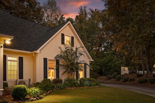 view of front of property with a yard