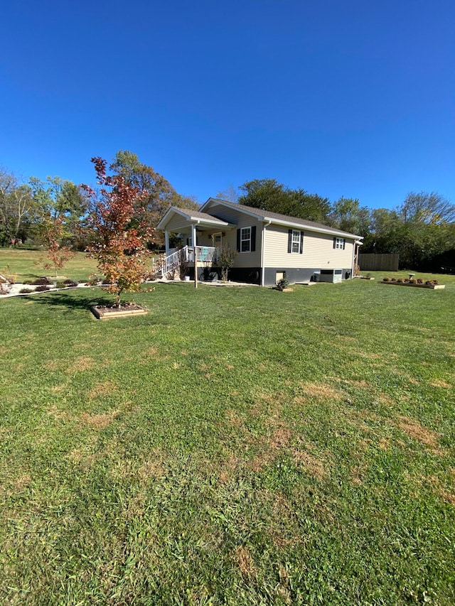 view of yard with covered porch