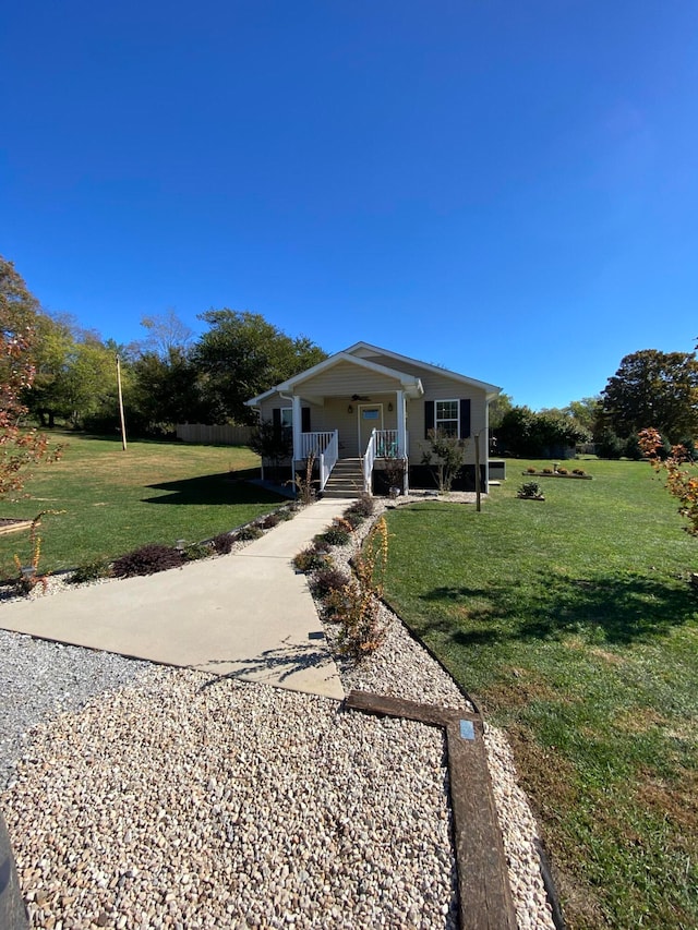 view of front of property featuring a front lawn and a porch