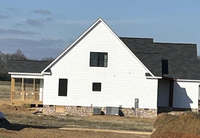 rear view of property with central air condition unit