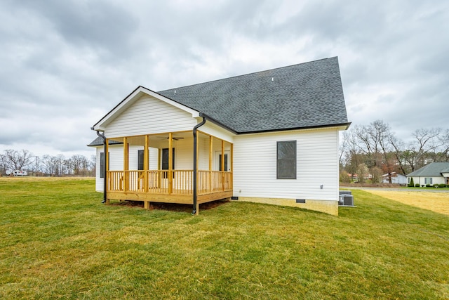 back of property featuring a shingled roof, a lawn, a ceiling fan, crawl space, and a deck