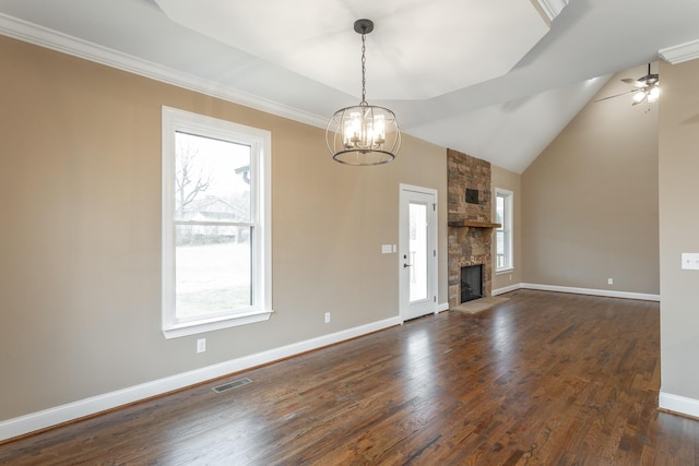 unfurnished living room with baseboards, visible vents, lofted ceiling, dark wood-style flooring, and a fireplace