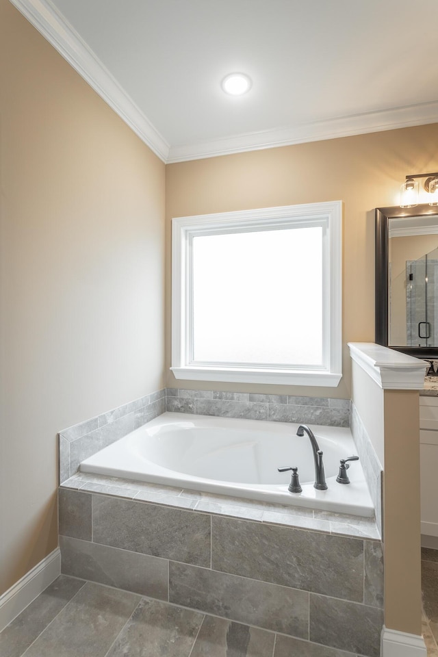 full bathroom with ornamental molding, a garden tub, vanity, and a shower stall