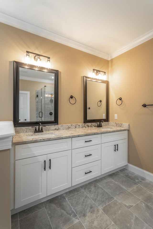 bathroom featuring crown molding, a sink, and double vanity